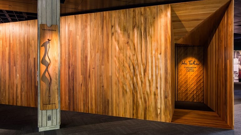 Entrance to the document room at the He Tohu exhibition, features traditional carving.