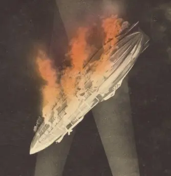 Postcard showing a Zeppelin highlighted by searchlights, falling in flames.