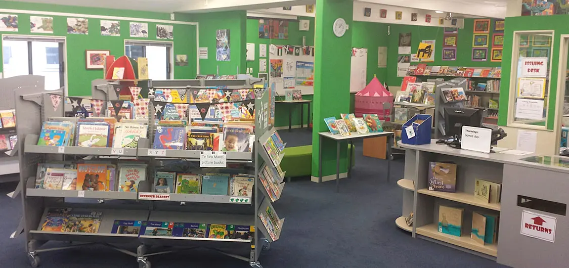 Inside a school library with books on display.