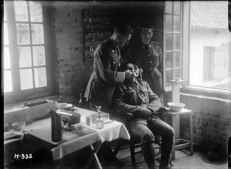 Soldier having new dentures fitted during World War I. Nielles, France. Royal New Zealand Returned and Services' Association: New Zealand official negatives, World War 1914-1918.