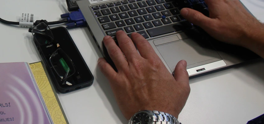 An individual using a laptop.