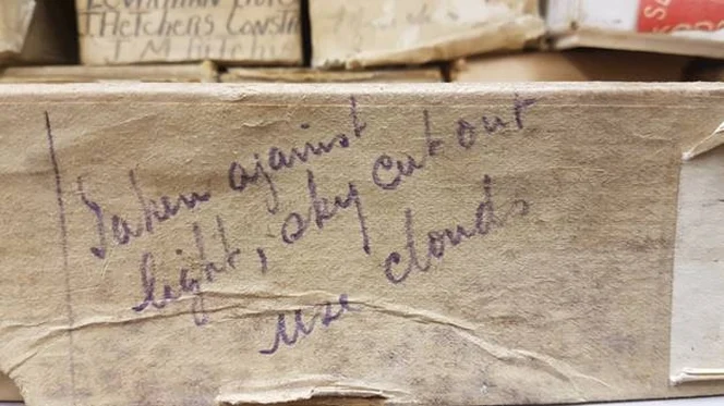 Inscription on a film box, made by Moore on location, sent with the film to his staff at the business in Wellington.