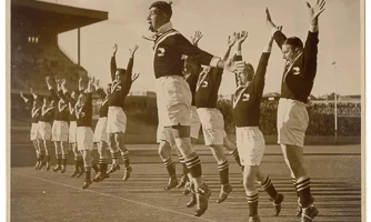 New Zealand rugby league players jumping into the air, performing the haka.