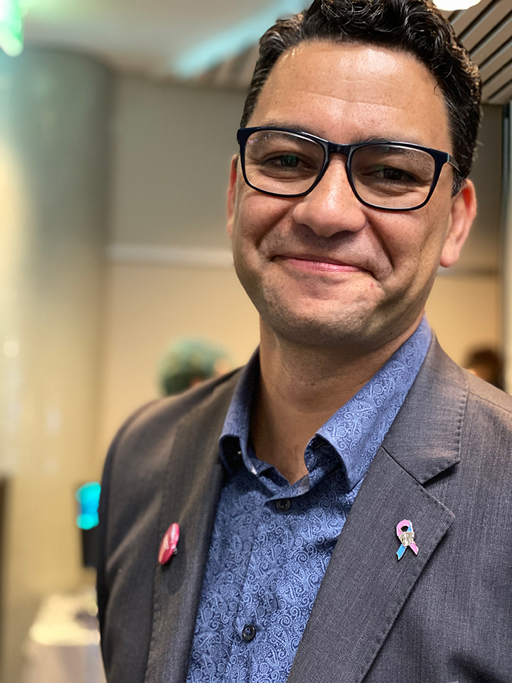 A man smiling at the camera.