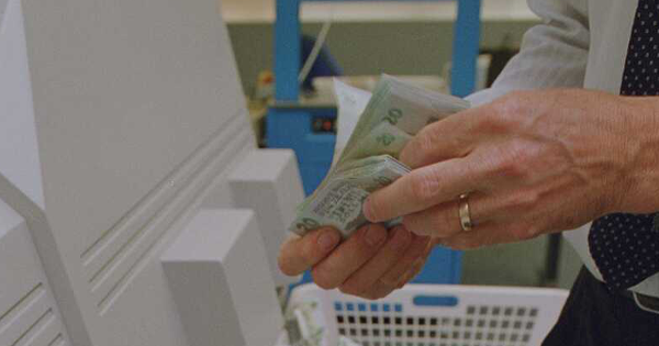 Hands holding money. 