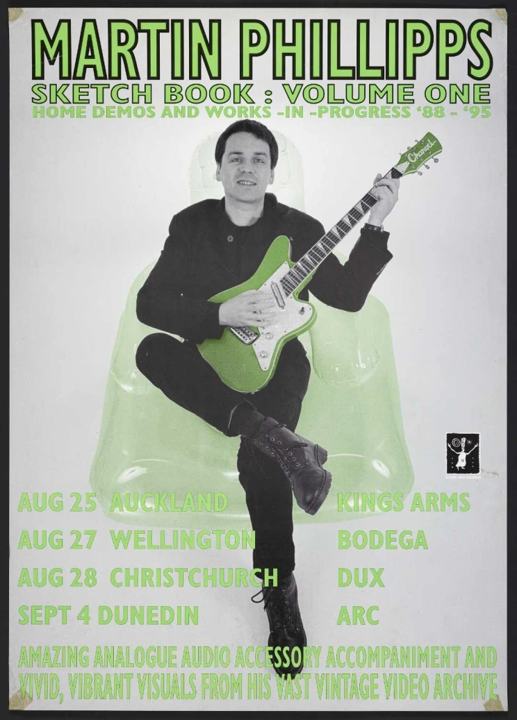 Poster announcing a sound recording release and a series of four gigs, shows a photograph of a smiling Martin Phillips holding a Charvel electric guitar and seated in a see-through blow-up armchair.