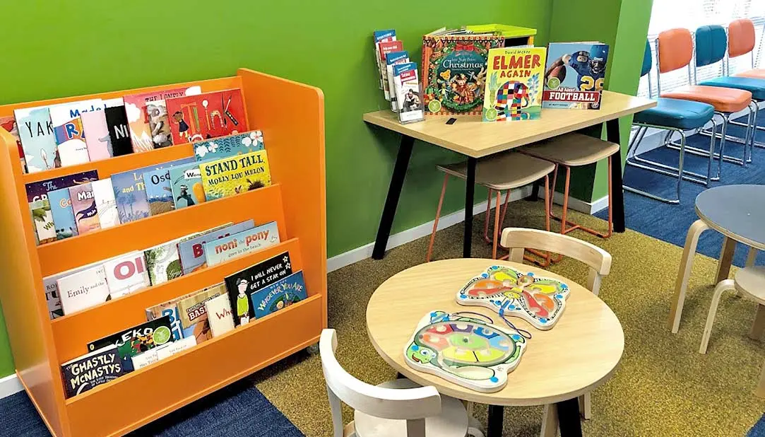 Picture book display next to tables and chairs at Ministry of Social Development (MSD) Rangiora.