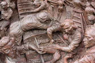 The Battle Of Britain Memorial. The sculptor has implied strength by emphasizing the physical attributes of some of the women, for example their forearms. 