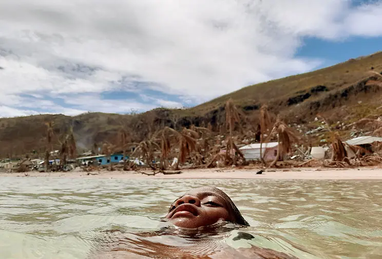 Child floating in water.