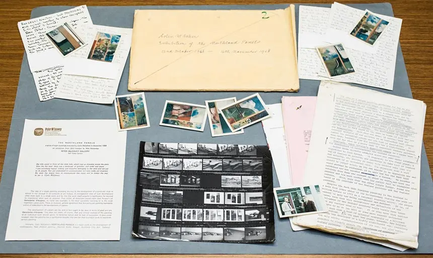 Contents of Exhibition File Number 2, pictures and letters displayed on a table