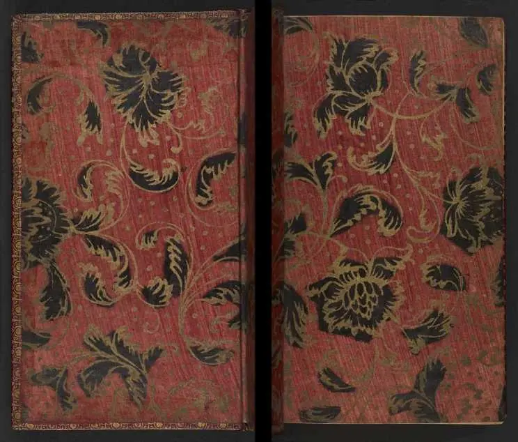 Early 18th century gilt endpapers on a red paste paper ground.