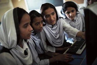 Students (from left) Sawera, Fouzia, Zaruda, Sadia and Gulnaz work on educational programs in the computer room at Bagga Sheikhan school near Rawalpindi.