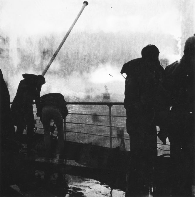 The Wahine crew setting up a tow line to fire to the tug Tapuhi.
