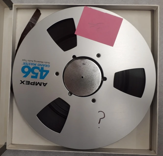 Shows a tape reel without any identifying information written on the outside.