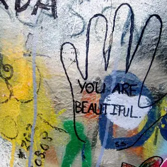 Graffiti-style collage, reading 'You are beautiful'.