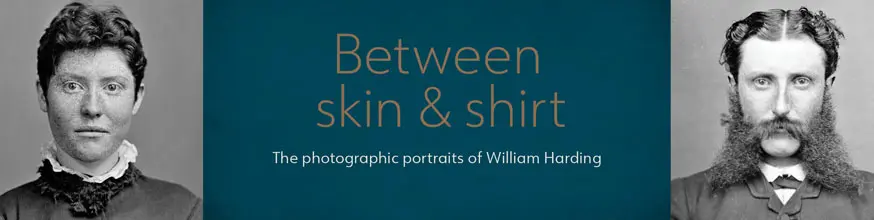 Victorian era black and white headshots, freckled woman wearing a high neck collar with a white ruffle, man has a magnificent moustache and side-whiskers that extend to his shoulders. Between skin & shirt: The photographic portraits of William Harding.