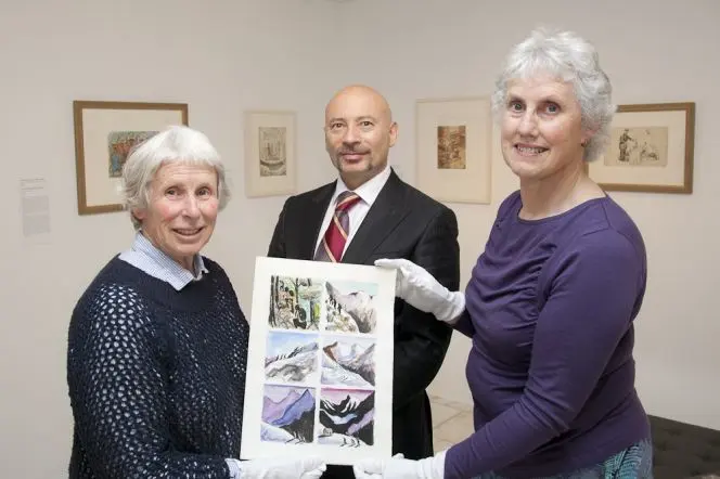 Tanya Ashken with a page from the album, along with Curator Marian Minson and Chief Librarian Chris Szekely.