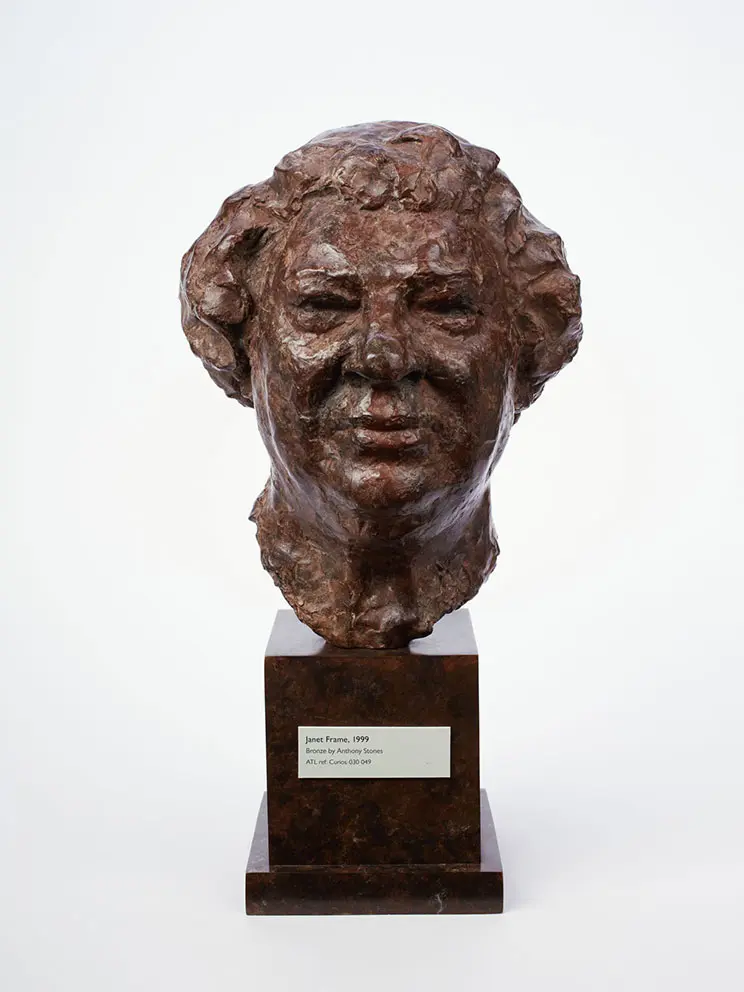 Bronze sculpture of a woman's head. 