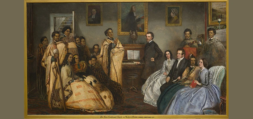 Painting by James Smetham showing a group of Māori in traditional dress meeting with a group of English people in formal dress in Wesley's house