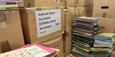 Boxes and books from school loans returned to National Library Services to Schools.