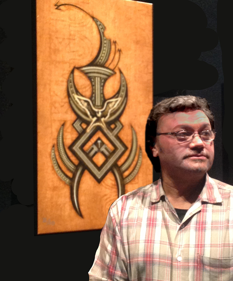 Man standing in front of a painting.