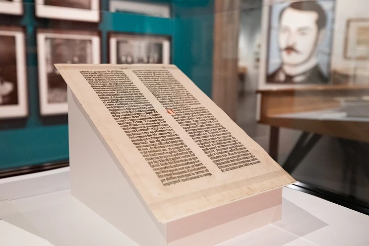 The bible leaf on display in the gallery supported on special mount.