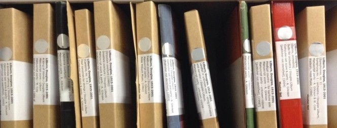 Music scores, shelved side by side.