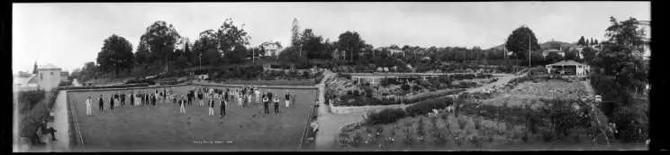 Nelson bowling green, taken 1924, showing members on the green and the clubhouse at right rear.