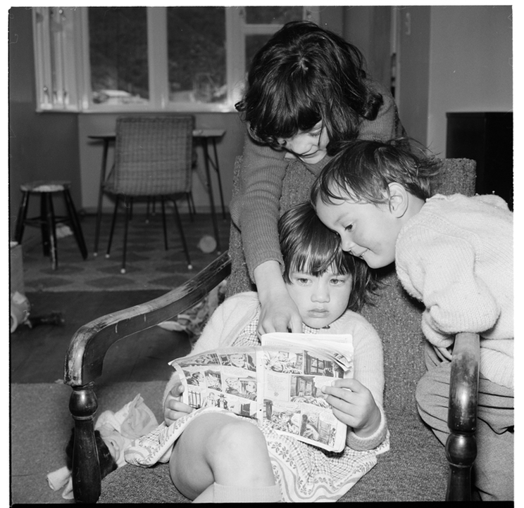 Scenes of children playing indoors and reading a comic at the Mataira family home in Stokes Valley, Lower Hutt, taken in 1964 by Ans Westra.