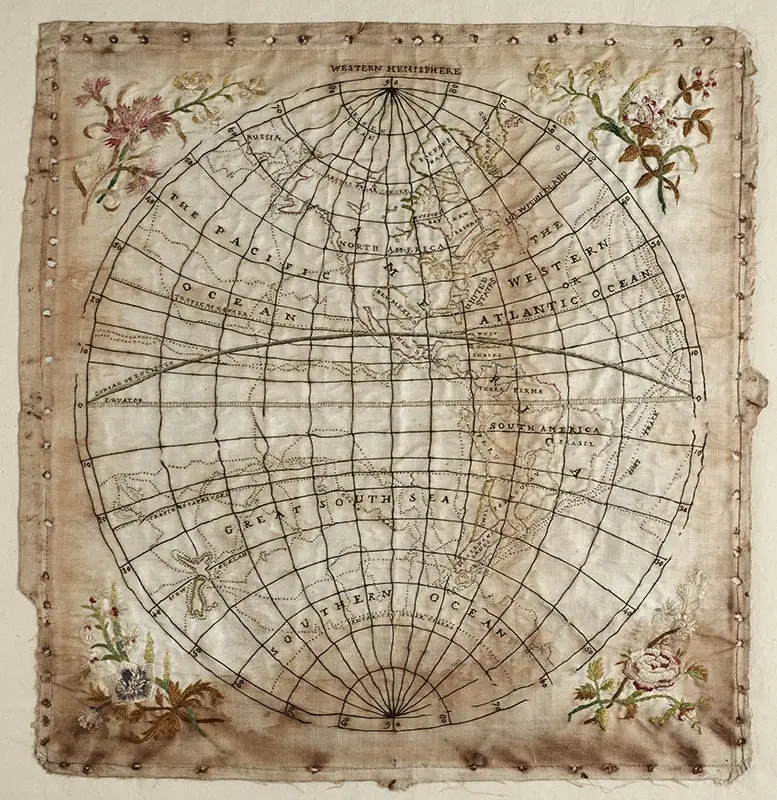 Colour photograph of Elizabeth Cook's embroidered map of the globe, showing her husband Captain James Cook’s 3 voyages in the Pacific.