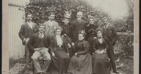 A black-and-white family photo featuring ten people.