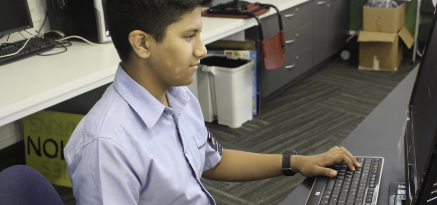 Student librarian at an OPAC computer.