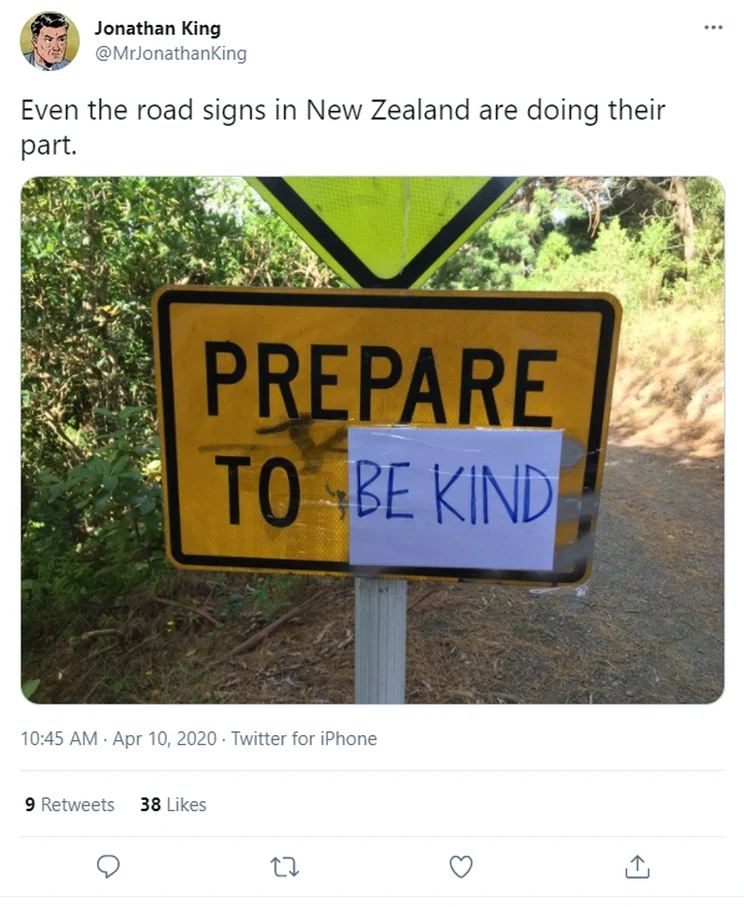 A yellow road sign which likely said 'Prepare to stop' has been changed by the addition of handwritten words on white paper that read 'be kind' covering the word 'stop'.