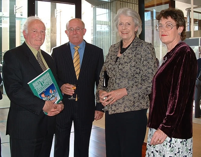 Portrait of four people standing together at the launch event.