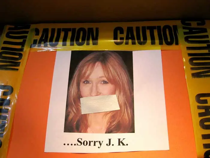 Masking tape placed over an image of J.K Rowling with the text '....Sorry J.K.'