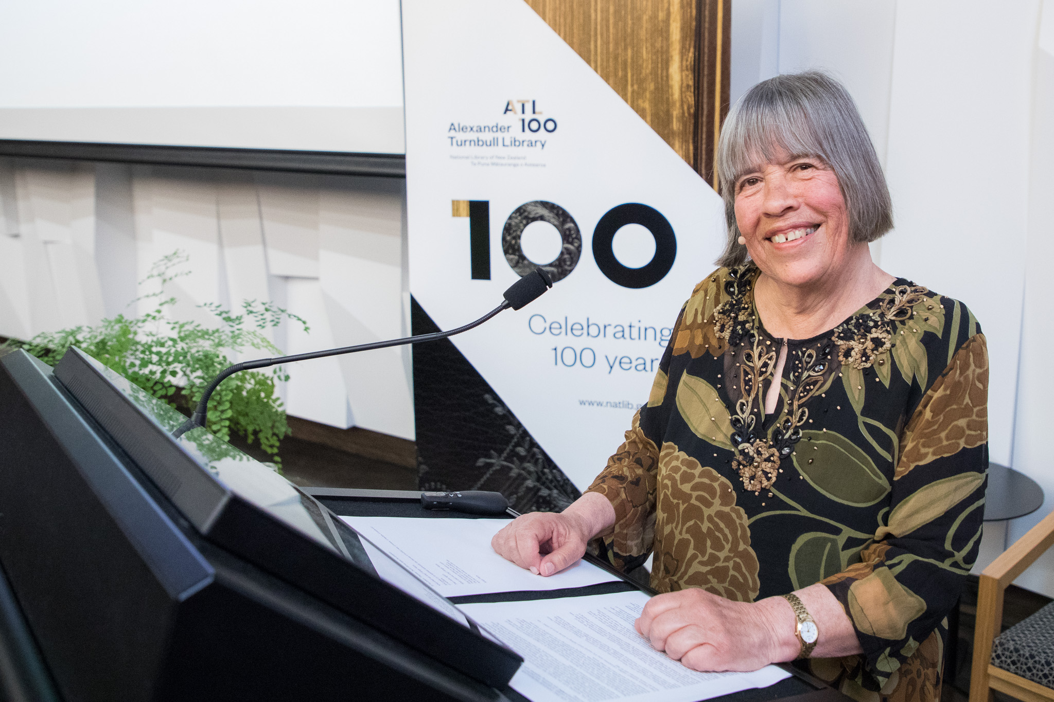 Dame Gillian Whitehead standing at a lecturn after delivering her lecture.