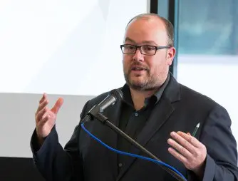 Joe Burton speaking at the National Library.