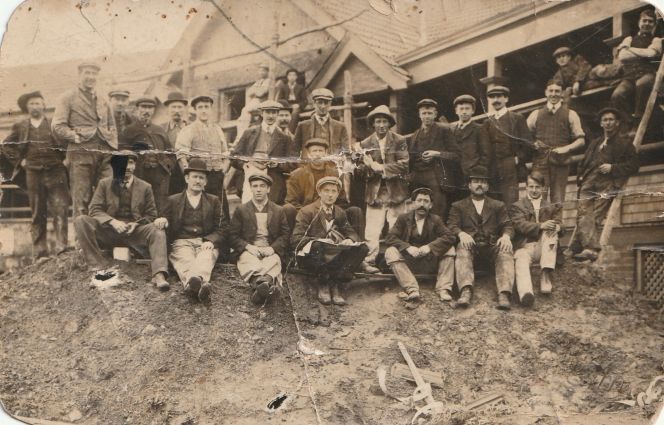 Ted Smith with builders at a worksite.