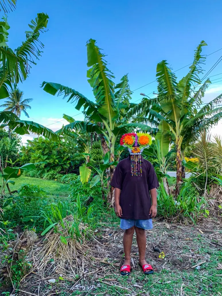 Photograph of a man wearing a mask.