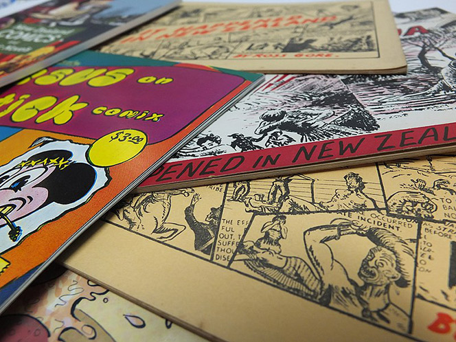 NZ Comics spread out on a table.