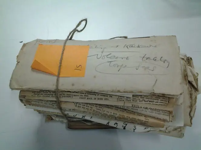 A stack of the Cowan papers, before conservation.