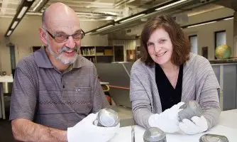 Pictured in white gloves, are the Turnbull Library’s Curatorial Services Leader, John Sullivan and Assistant Curator, Drawings, Paintings and Prints, Denise Roughan.