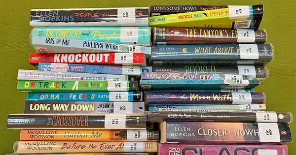 2 stacks of verse novels, showing their spines — available for schools to borrow from National Library's school lending service.