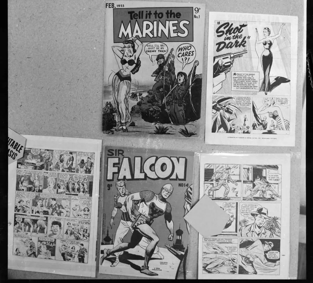 Pinboard with comics with titles like "Tell it to the Marines" and images that include pin-up images of women. 