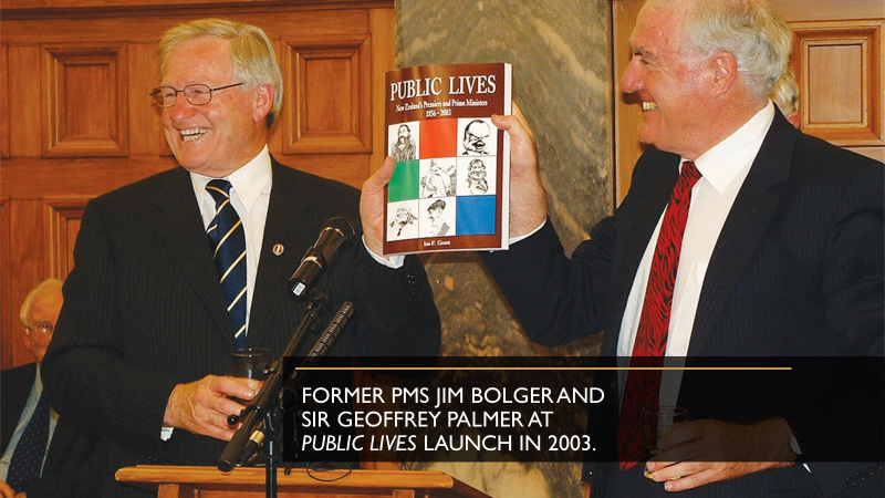 Shows Jim Bolger and Sir Geoffry Palmer behind a lecture, both are holding the same book up for people to see at the launch event for 'Public Lives'.