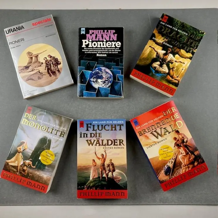 An arrangement of six books showing their covers with differing designs. 