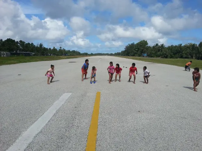 Children practicing their sprinting on the runway.