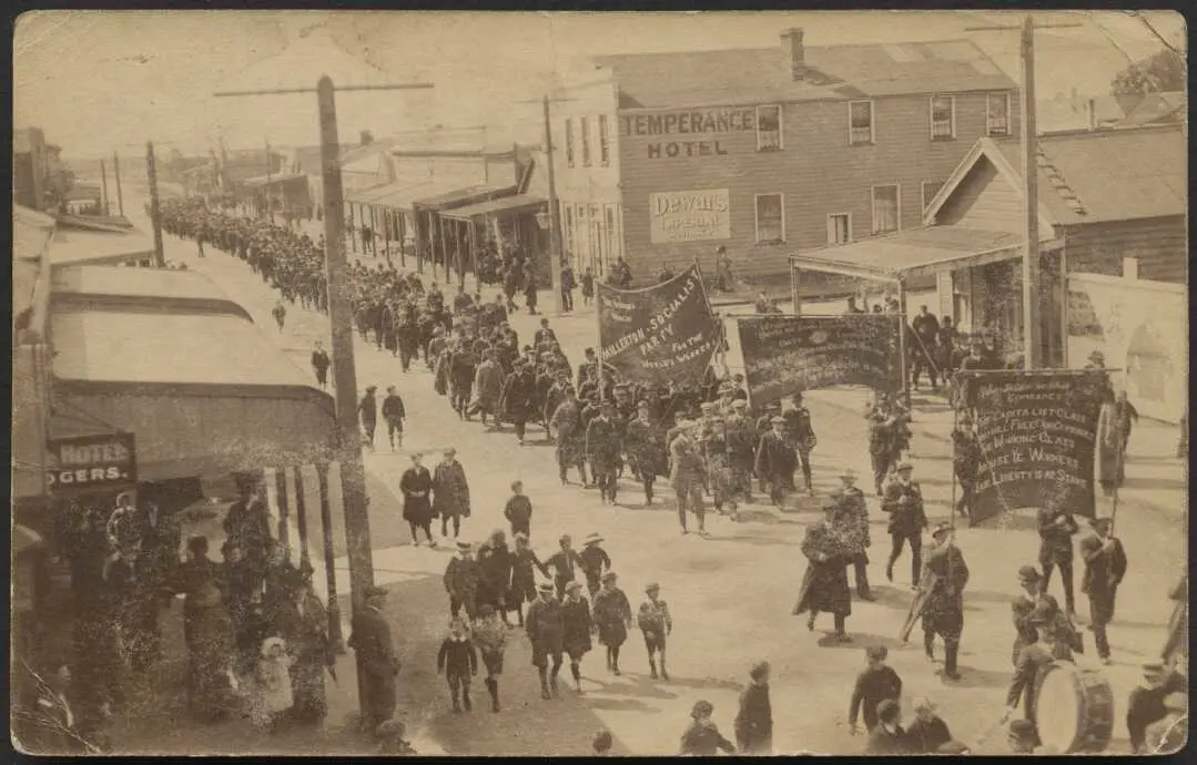 Members of the Millerton Socialist Party march down the main street of Waihi, past the Temperance Hotel, during the 1912 Waihi miners strike.