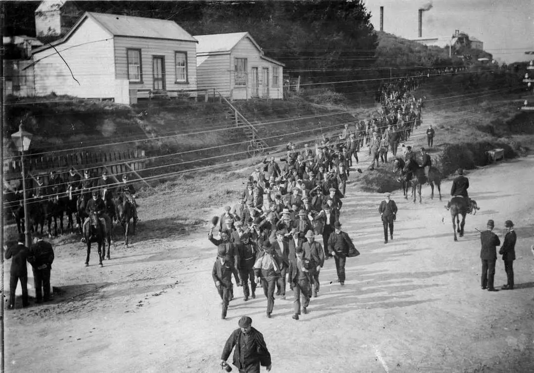 Strikebreakers, including mine superintendent Hubert Percy Barry (man with white beard on right of column head), during the Waihi miners' strike of 1912.