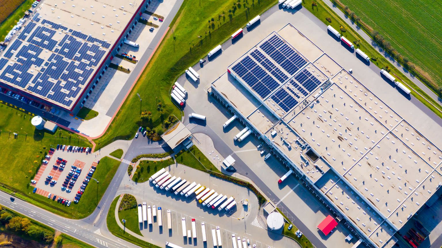 Warehouse with solar panels on its roof.
